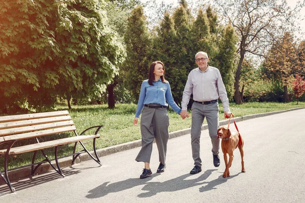 Couple of pensioner enjoying summer walking while going through the park fotos, imagens de © iakovenko123 #496338952