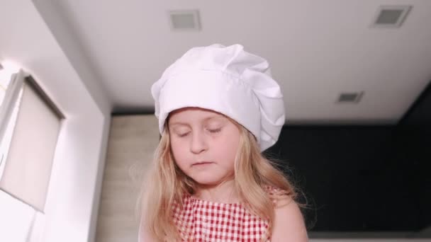 Little girl cook the dough for cookies — Stock Video