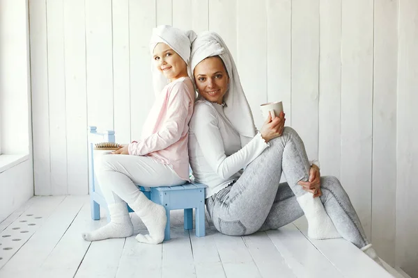 Mom playing with cosmetics with her daughter — Stock Photo, Image