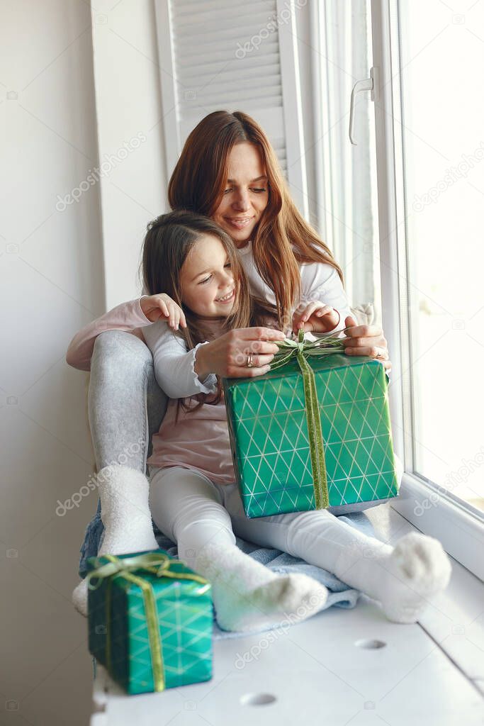 Family sitting at home with presents