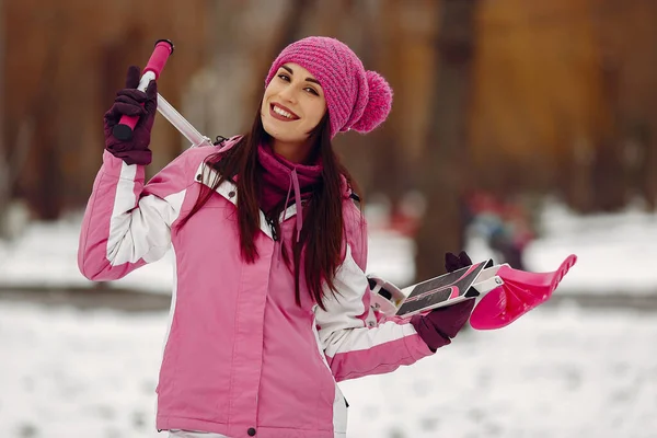 Woman in winter sports clothes looking at camera Royalty Free Stock Images