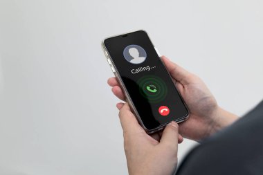 A smartphone with mobile screen showing a calling. Concept of communication, and conversation with a telephone network.