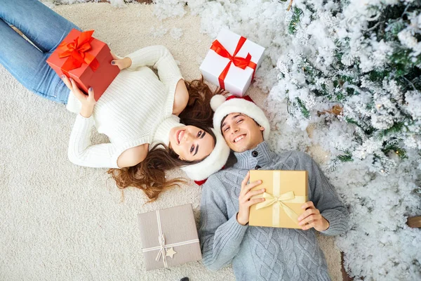 Happy young couple  having fun at Christmas. — Stock Photo, Image