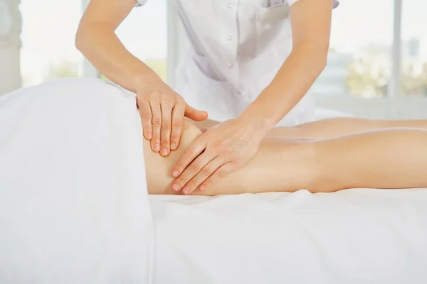 Foot massage in the massage room.