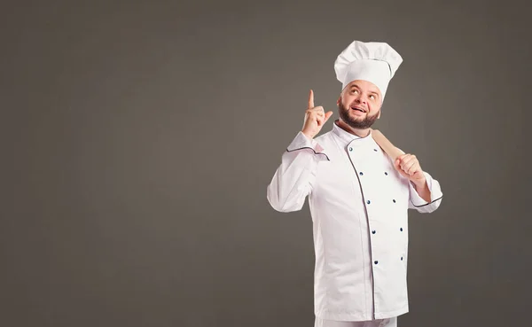 滑稽开朗的厨师在白色制服在背景上. — 图库照片