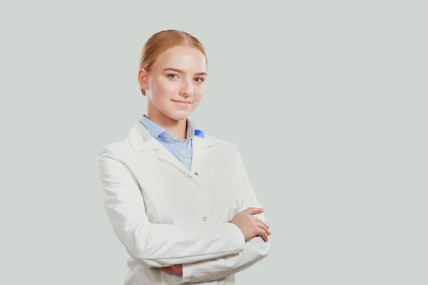 Confident young woman in white coat — Stock Photo, Image