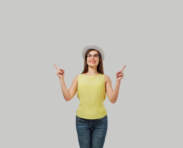 Casual woman pointing up — Stock Photo, Image