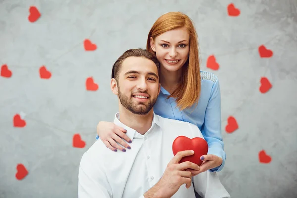 Happy couple with red heart. Valentines day. — Stock Photo, Image