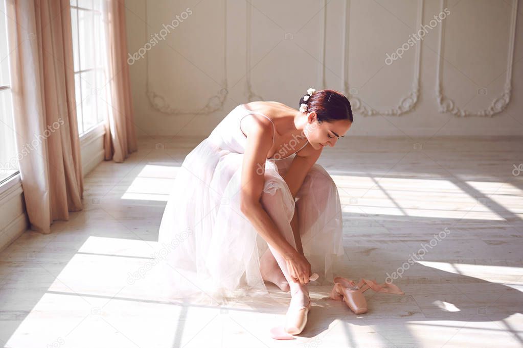 Ballerina wearing pointe shoes in the room
