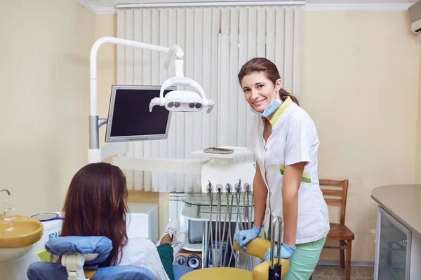 Female dentist smiling in the dental office