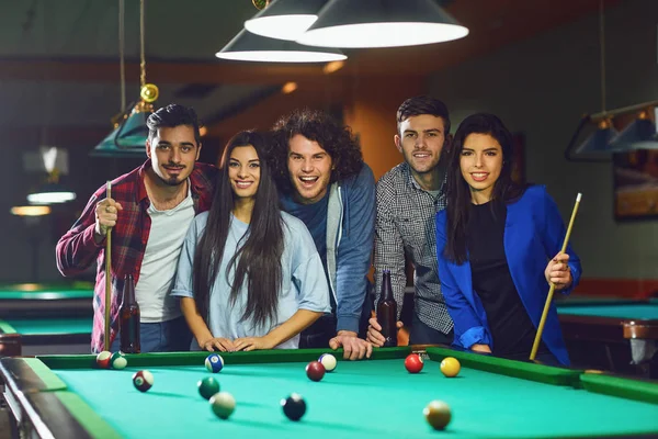 A group of young people playing fun billiards. — Stock Photo, Image