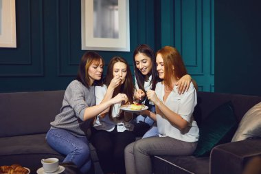 Young women chatting at a friends meeting at home