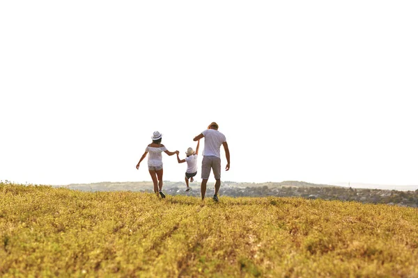 Happy family walking in nature in summer. — Stock Photo, Image
