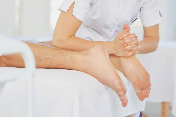 Foot massage.Masseur massage the client. — Stock Photo, Image