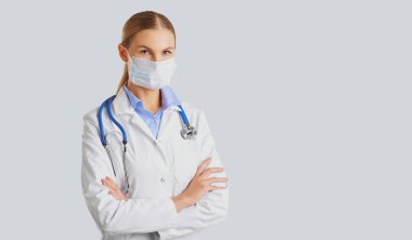 Woman doctor wearing a mask . clipart