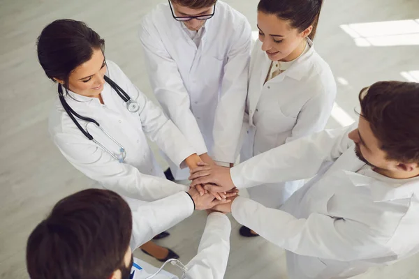 Group of doctors joined hands together. Medicine healthcare clinic hospital concept . — Stock Photo, Image
