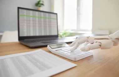 Future employee robotic hand, mechanical arm on calculator, accounting machining processes, checking stock market data, AI-powered accounting software trading stocks information for growth, profit
