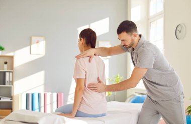 Rehabilitation, woman back, spine, shoulder massage, physical therapy by professional nurse, manual chiropractor, physical therapist doctor. Injuries, trauma problems, exercise for mobility, posture
