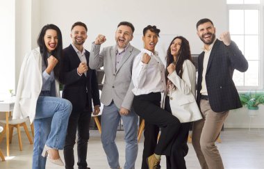 Group portrait of a happy business people celebrating success, radiating partnership joy in the office, vibrant arena with a team achievement and collective pride take center stage.