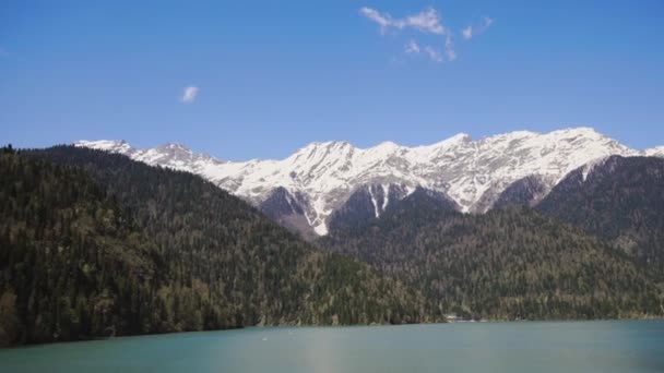 Aerial panorama of mountainous terrain in sunny day, over huge lake — Stock Video