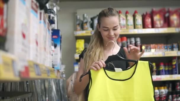 Woman buys new uniform — Stock Video