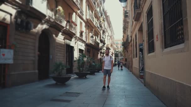 Guy walking on street alone in summer. — Stock Video