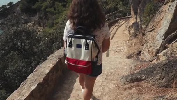 European tourist on a hike with backpack. — Stock Video
