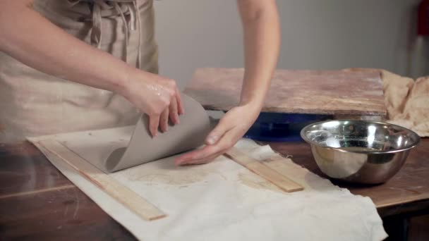 Woman working with a clay indoor. — ストック動画