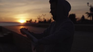 Boxer taping hands before training