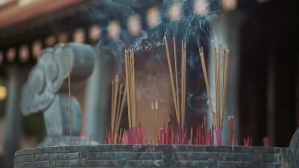 Incense sticks is burning in asian buddhist temple — Stock Video