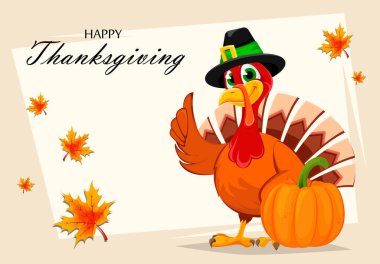 Şükran Günü hindisi balkabağının yanında duruyor.