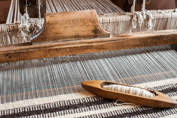 Hungarian homespun weaving. Traditional weaving hand-loom for carpets in Transylvania.