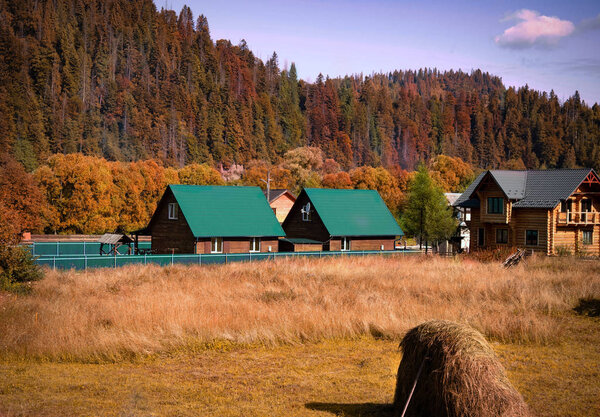 Colorful autumn landscape in the mountain village. Carpathian Mountains, Ukraine