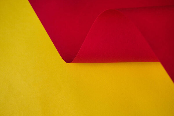 Abstraction of a design paper red and yellow. Empty space on monochrome paper.  