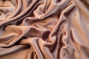 Kumaş altın dalgalar - arka plan ve doku için malzeme. Yakın u