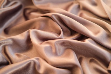 Kumaş altın dalgalar - arka plan ve doku için malzeme. Yakın u