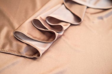 Kumaş altın dalgalar - arka plan ve doku için malzeme. Yakın u