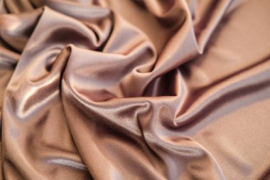 Kumaş altın dalgalar - arka plan ve doku için malzeme. Yakın u