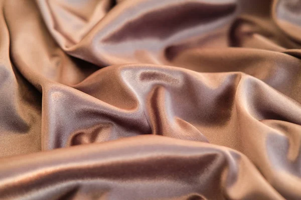 Fabric gold waves - material for background and texture. Close u