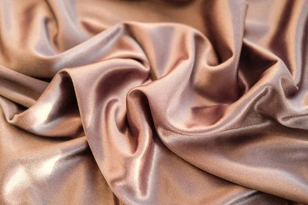 Fabric gold waves - material for background and texture. Close u