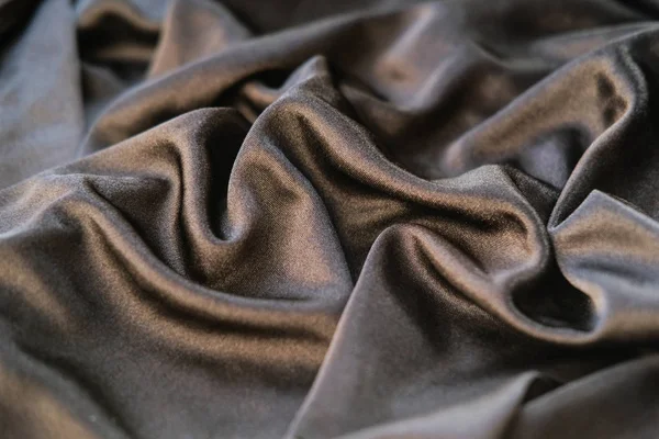 Fabric gold waves - material for background and texture. Close u