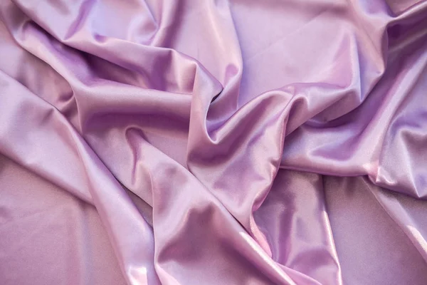 Close up pink fabric. The purple fabric is laid out waves. Fuchs — Stock Photo, Image