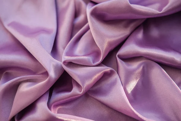 Közelről rózsaszín szövet. A lila szövet lefektetett hullámok. Fuchs — Stock Fotó