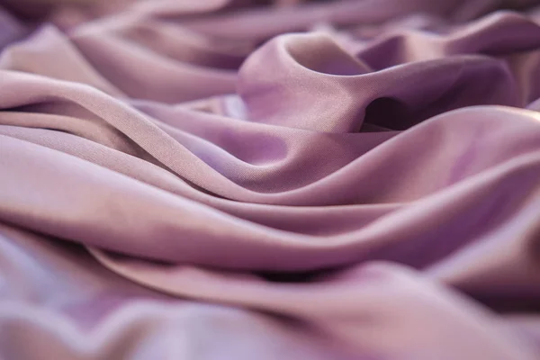 Közelről rózsaszín szövet. A lila szövet lefektetett hullámok. Fuchs — Stock Fotó