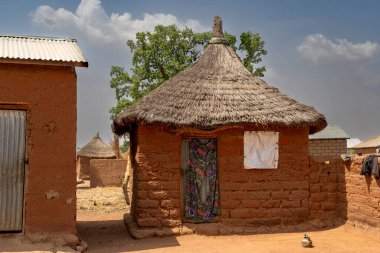 A traditional clay hut with thatched roof in a Mbororo village reflects the simple yet functional lifestyle rooted in culture and traditions.