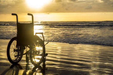 gün batımı çocuksu tekerlekli sandalye ufuk kum