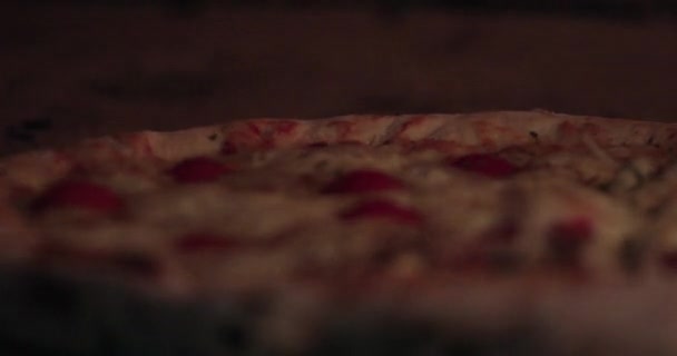 Delicious pizza being roasted in traditional wood oven — Stock Video