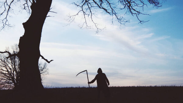 soft focus. Grim Reaper sunset silhouette. concept of death.