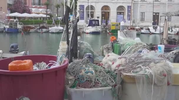 Fishing vesselis with drift nets parked near pier. — Stock Video