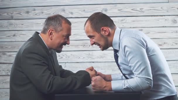 Business anger conflict. Two businessmen fiercely look at each other. — Stock Video